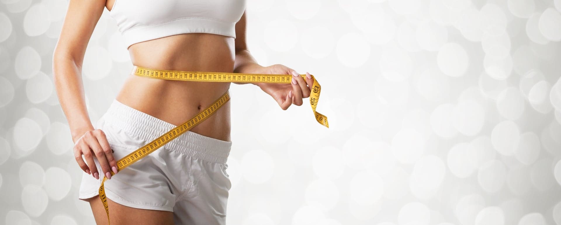 Redukce hmotnosti – štíhlý pas s měřicí páskou